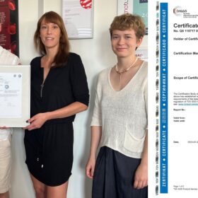 Proud hemotune AG team showing ISO 13485 certificate